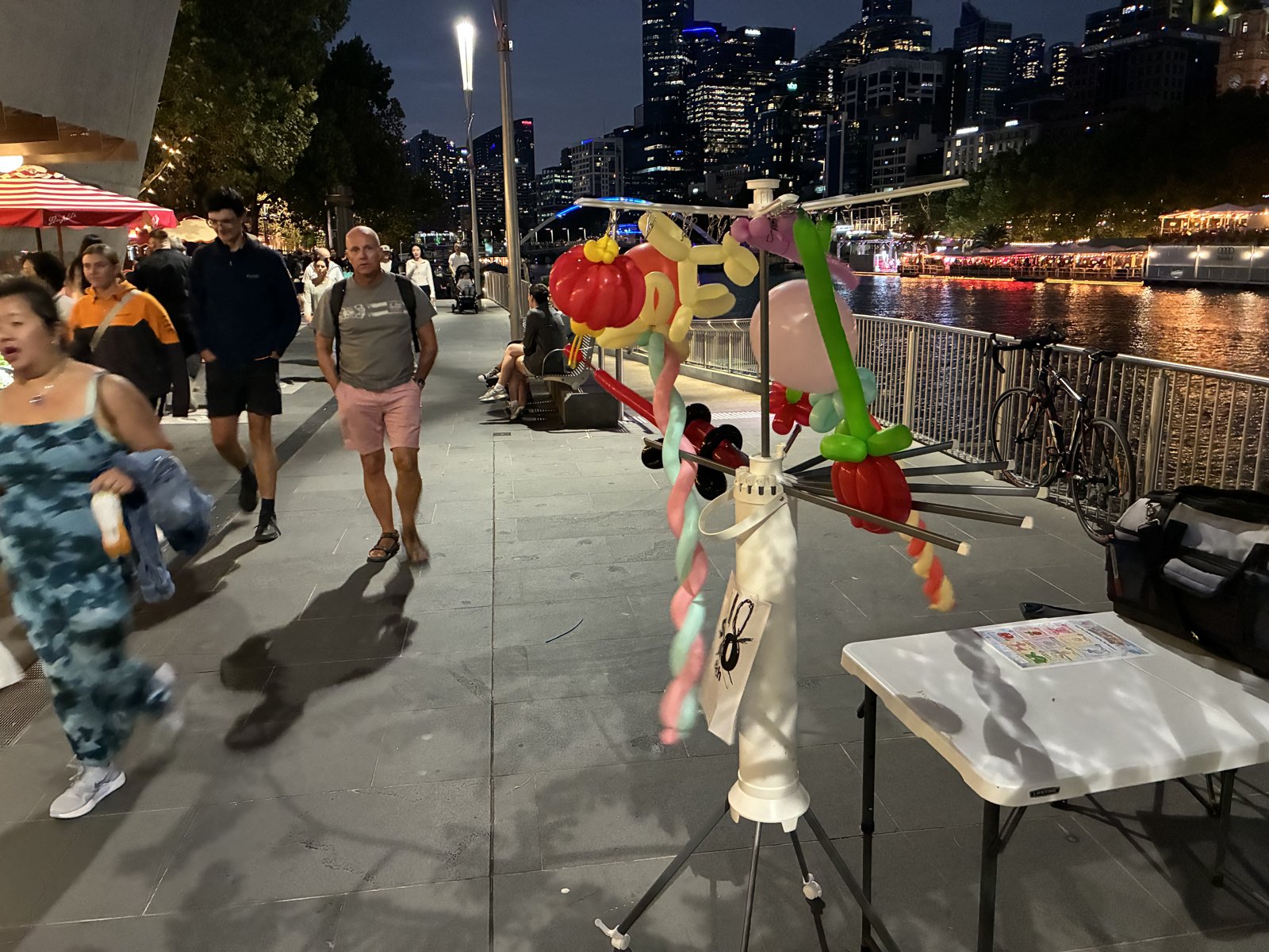 Saturday night on the Southbank promenade — the city does the lighting.